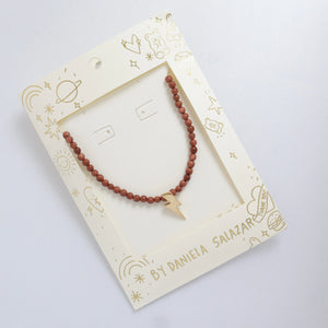 Choker rayo dorado en piedra natural café
